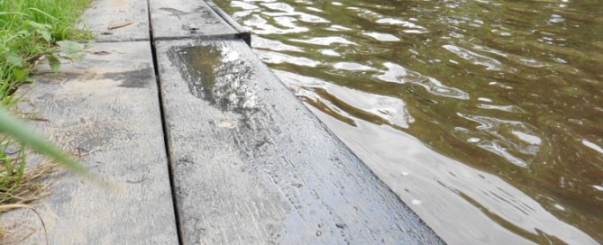 A landing stage at a rowing club made from recycled plastic beams due to their ability to sit in water and remain rot-free