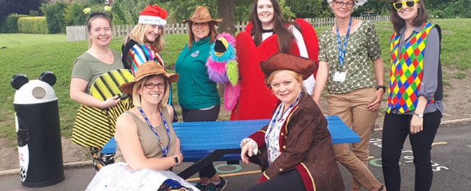 School staff and their recycled plastic picnic table