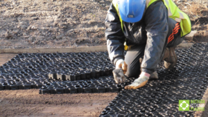 Groundworker installing Hebden X Grids