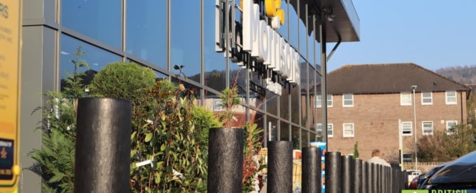 Recycled plastic bollards, reinforced with steel cores, at a Morrisons supermarket in Abergavenny.