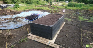 The finished raised bed, filled with topsoil.