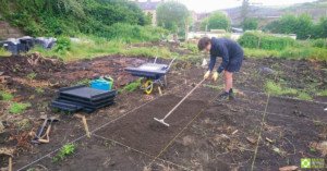 Preparing the ground for the raised beds.