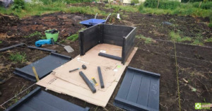 All the components of a raised bed, laid out on the ground, prior to assembly.