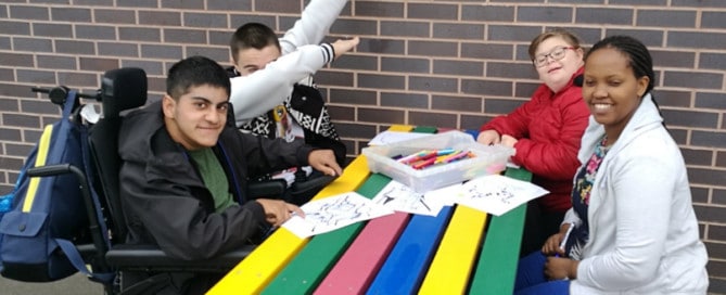 A multicoloured wheelchair accessible Bradshaw picnic table made from British Recycled Plastic