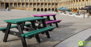 Green and purple Denholme picnic tables at the Piece Hall