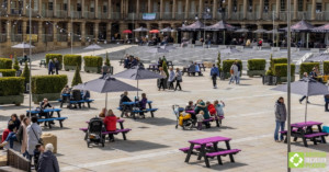 Various Denholme picnic tables at The Piece Hall with visitors