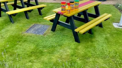 Garden with picnic tables and van. British Recycled Plastic