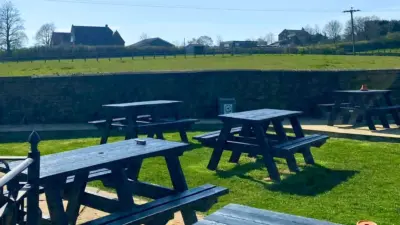 Outdoor seating in a rural pub beer garden. British Recycled Plastic