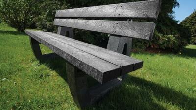 A black Harewood recycled plastic bench