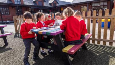 Holmfirth table with kids writing