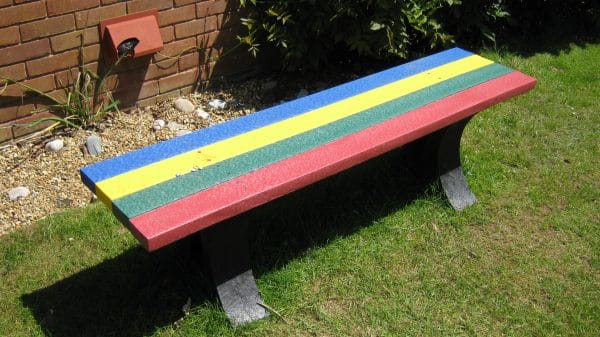 An Oakworth recycled plastic bench with a multi coloured top