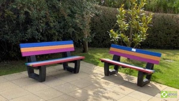 A pair of multicoloured recycled plastic Harewood benches