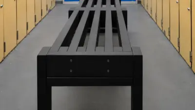 Long black bench in locker room. British-Recycled-Plastic-