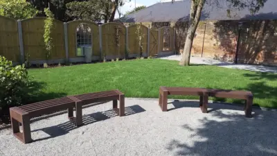 Curved Benches in a landscaped garden area. British Recycled Plastic