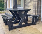 The Batley "walkthrough" recycled plastic picnic table is key part of our accessibility range of furniture as less mobile users can get to the seats without having to lift their legs very much. This table is at the Overgate Hospice in Elland, West Yorkshire.