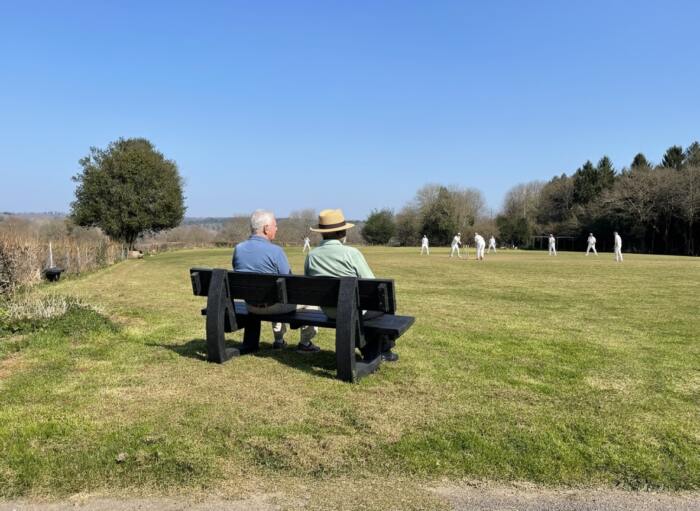 bench-Harewood-men-watching-cricket-recycled-plastic-bench 2 Men sat at a British Recycled Plastic Harewood Bench looking at field