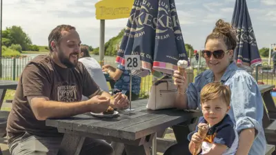 Family enjoying ice cream outdoors. British Recycled Plastic.