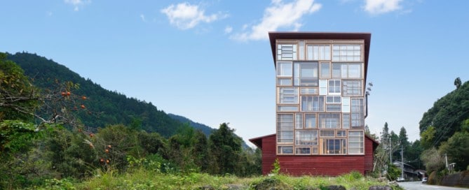 A glass faced building using repurposed and salvaged windows