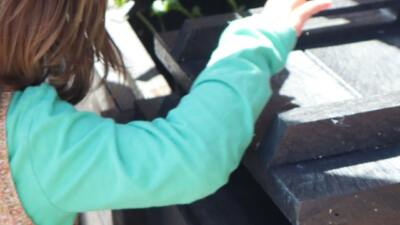 A child peeping in to a 500mm wide Micro Callis compost bin