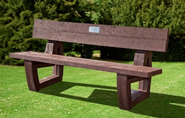A brown recycled plastic Harewood memorial bench