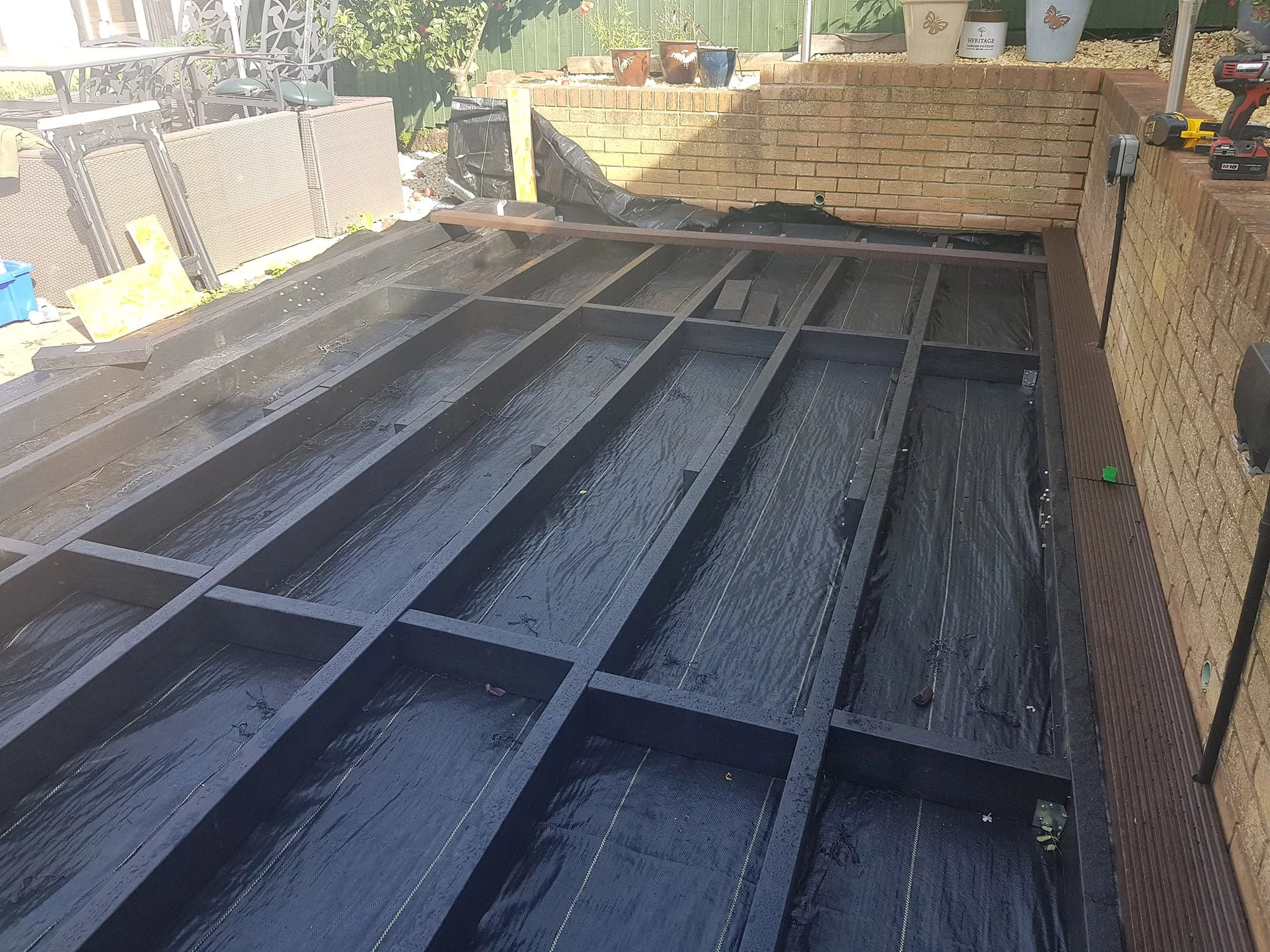 black recycled plastic lumber laid down for decking 