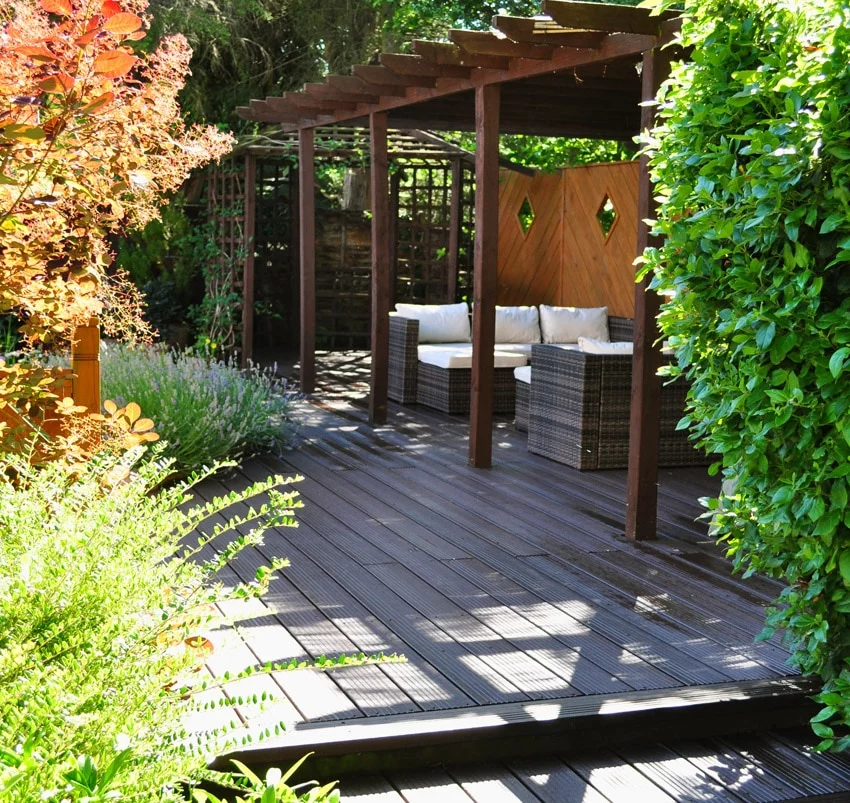 Brown recycled plastic rot-proof decking with a 25 year guarantee installed on this beautiful patio