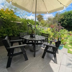 The recycled plastic Roundhay garden dining set in a private garden, guaranteed for 25 years