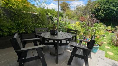 The recycled plastic Roundhay garden dining set in a private garden, guaranteed for 25 years