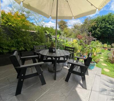 The recycled plastic Roundhay garden dining set in a private garden, guaranteed for 25 years