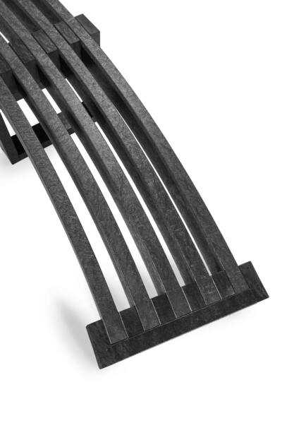 a detail of a Skipton Curved recycled plastic bench in black