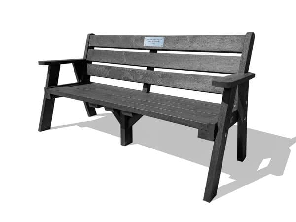 The recycled plastic Ilkley sloper memorial bench with stainless steel plaque and armrests in black