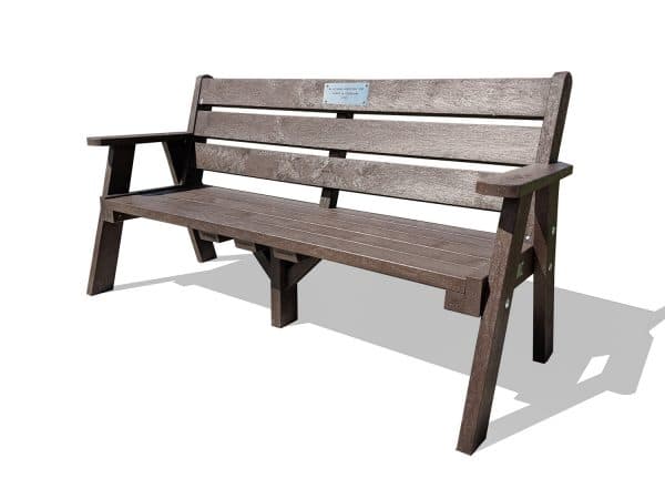 The recycled plastic Ilkley sloper memorial bench with stainless steel plaque and armrests in brown