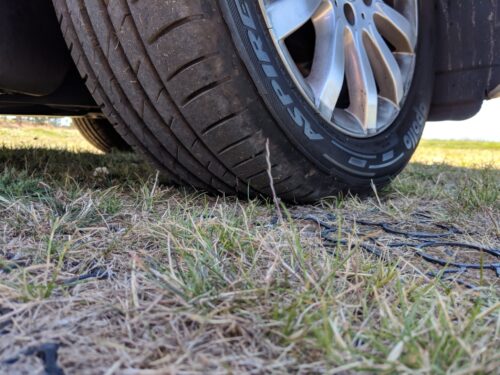 Grass growing through the Hebden X-Grid permeable pavers used in an overflow car-park