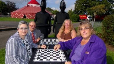 The Otley recycled plastic activity table in black, available with a variety of different tops, seen here at Victoria Park in Bideford