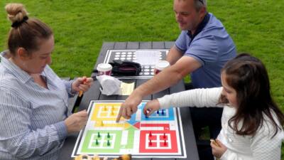 The Otley recycled plastic activity table in black, available with a variety of different tops, seen here at Victoria Park in Bideford