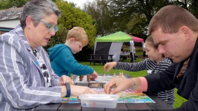The Otley recycled plastic activity table in black, available with a variety of different tops, seen here at Victoria Park in Bideford