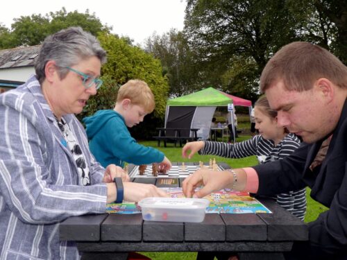 The Otley recycled plastic activity table in black, available with a variety of different tops, seen here at Victoria Park in Bideford