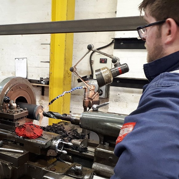 The core of a recycled plastic bollard being routed out in preparation for a steel core to be fitted for a Morrison supermarket car park