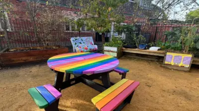 Colourful picnic table in community garden. colourful wheelchair accessible table. British recycled Plastic