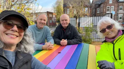 Four people at a colourful wheelchair accessible table. British recycled Plastic