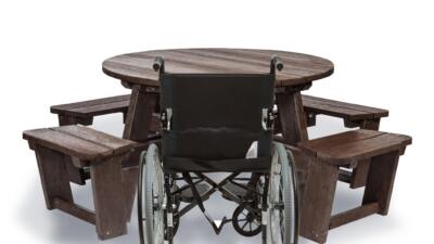 Recycled plastic circular Calder picnic table with wheelchair access in brown showing chair