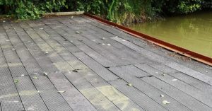 Old composite decking at Slipper Bridge, replaced with our recycled plastic lumber decking boards