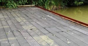 Old composite decking at Slipper Bridge, replaced with our recycled plastic lumber decking boards