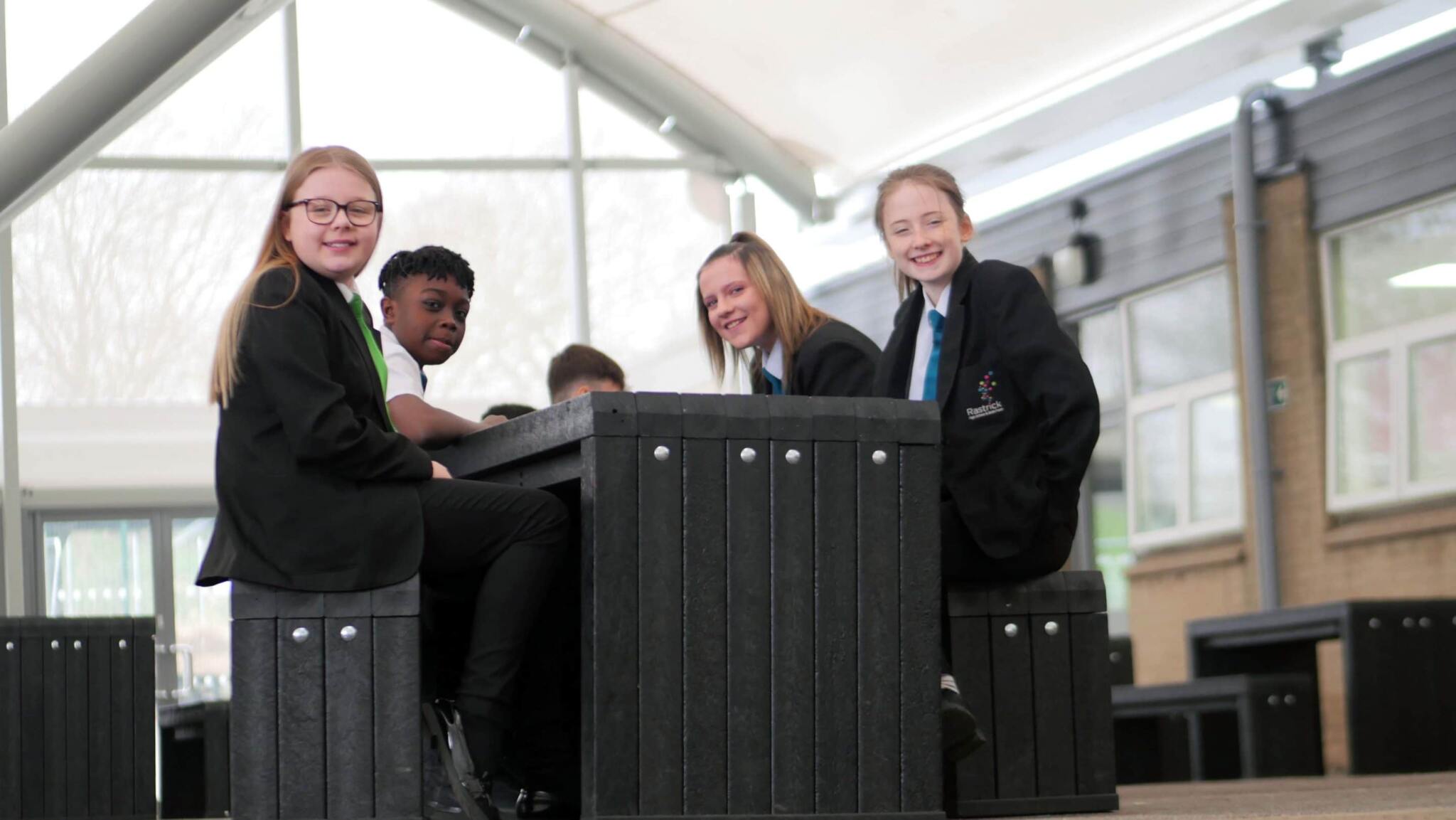 Pupils at Rastrick High School using out recycled plastic furniture