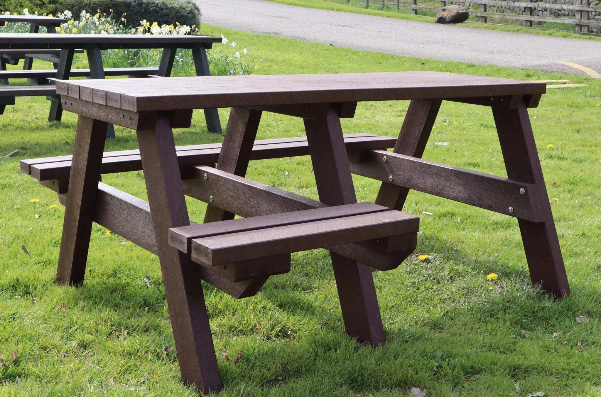 A brown Bradshaw wheelchair accessible picnic table from British Recycled Plastic outdoor furniture for schools