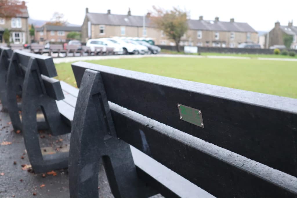 Harewood bench in black with plaque at Clitheroe Cricket Club engineered from British Recycled Plastic 6