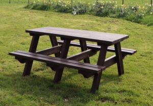 Denholnme black picnic benches at a golf club