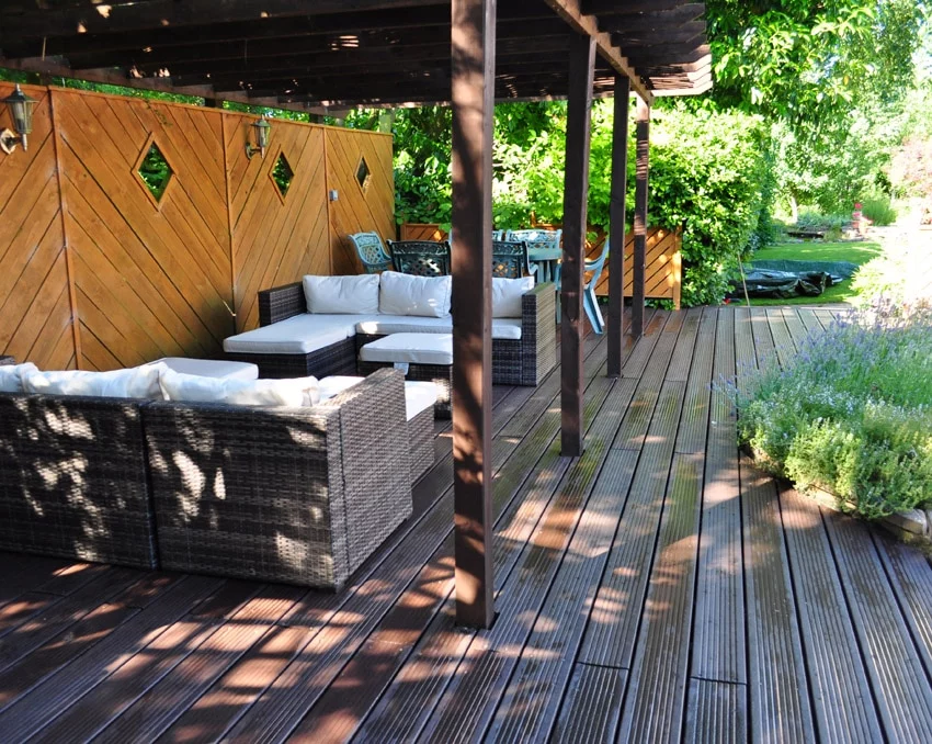 brown decking next some chairs in a relaxing retreat 