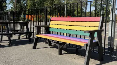 Colourful bench in a park - Ilkley. British Recycled Plastic