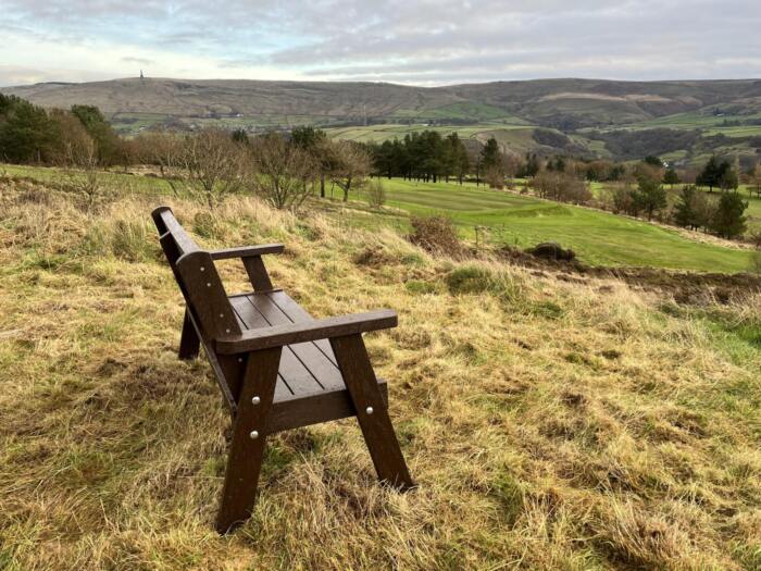 Lesley Wallace - Leisure - Golf - INV - 5726 Ilkley Memorial Bench An Ilkley recycled plastic brown bench. Placed over looking the Calder valley.